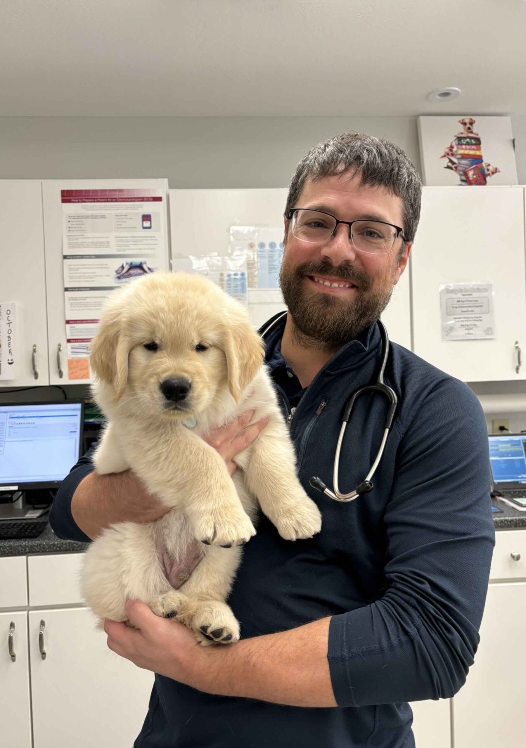 Dr. Chris Lynch holding a puppy